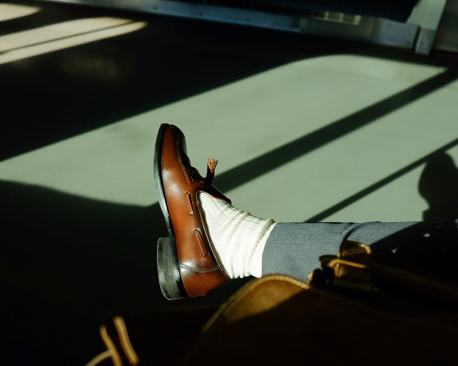Men's leather loafer worn with socks